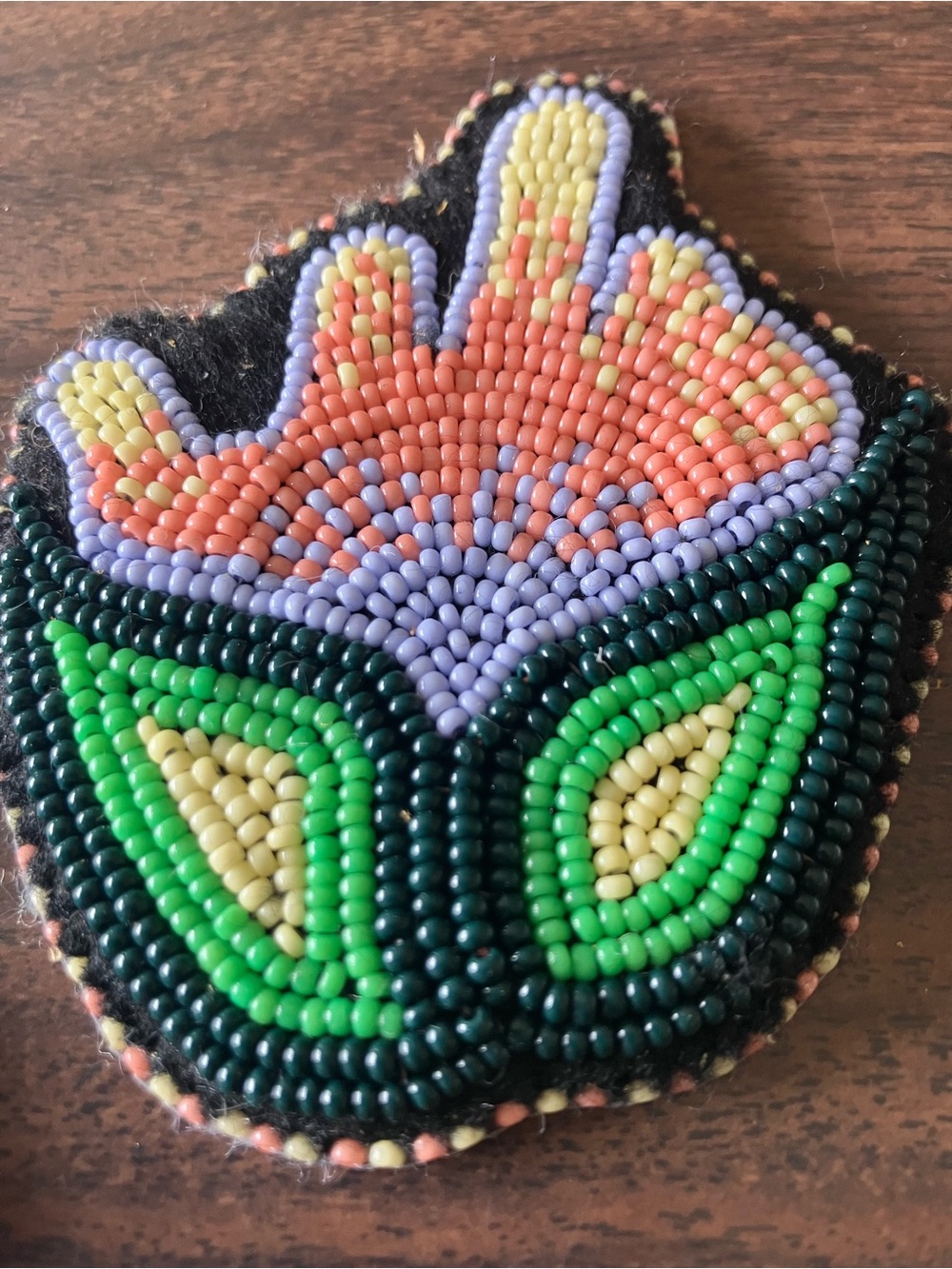 Indigenous floral flat stitch beadwork patch  resist middle finger flower